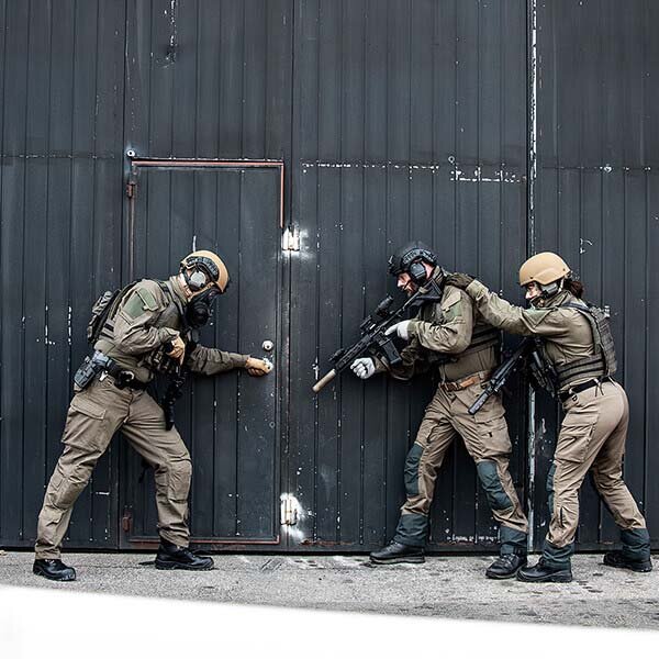 Law enforcement personnel at a door